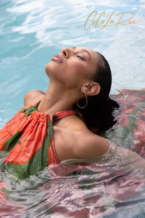 CLR Peach Flower Maxi an exclusive tropical floral print.  Cut away under the arm creating a trapeze silhouette with soft gathers falling to a voluminous and undulating maxi length skirt. A perfect dress for carry on your vacation trip this summer.
