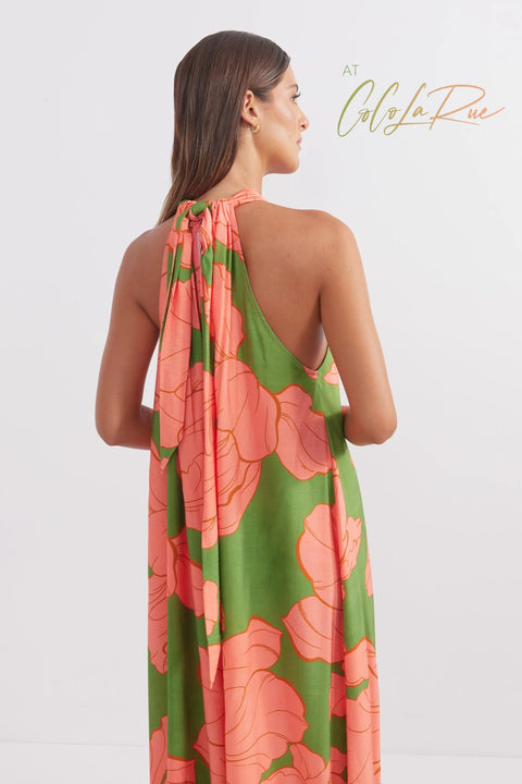 CLR Peach Flower Maxi an exclusive tropical floral print.  Cut away under the arm creating a trapeze silhouette with soft gathers falling to a voluminous and undulating maxi length skirt. A perfect dress for carry on your vacation trip this summer.