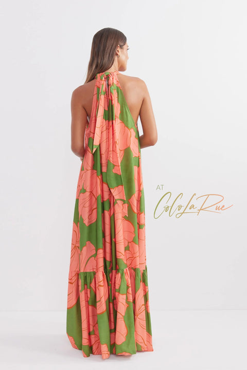 CLR Peach Flower Maxi an exclusive tropical floral print.  Cut away under the arm creating a trapeze silhouette with soft gathers falling to a voluminous and undulating maxi length skirt. A perfect dress for carry on your vacation trip this summer.