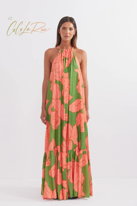 CLR Peach Flower Maxi an exclusive tropical floral print.  Cut away under the arm creating a trapeze silhouette with soft gathers falling to a voluminous and undulating maxi length skirt. A perfect dress for carry on your vacation trip this summer.