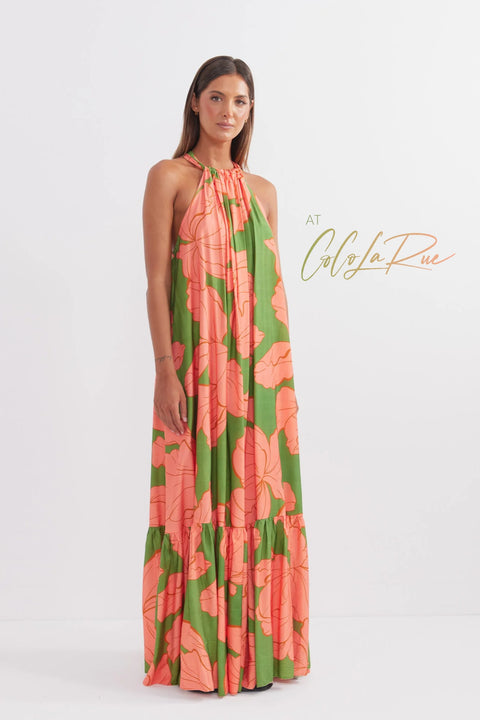 CLR Peach Flower Maxi an exclusive tropical floral print.  Cut away under the arm creating a trapeze silhouette with soft gathers falling to a voluminous and undulating maxi length skirt. A perfect dress for carry on your vacation trip this summer.
